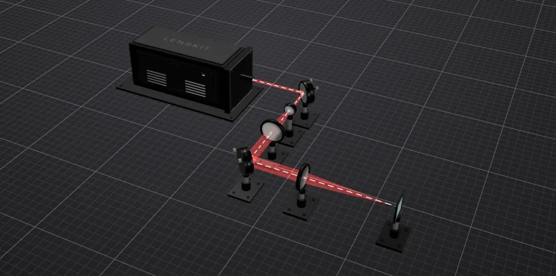 Layout of the beam delivery starter system: a laser, two fold mirrors, a two-lens beam expander, and a focusing lens.